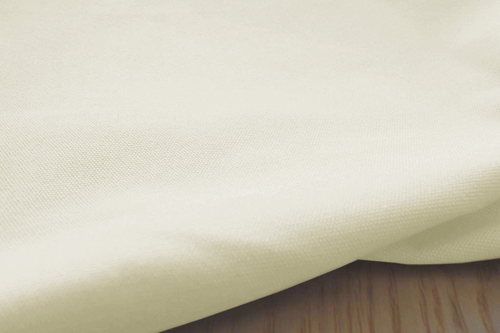 Close-up shot of the structure of the Amara Cream cotton fabric