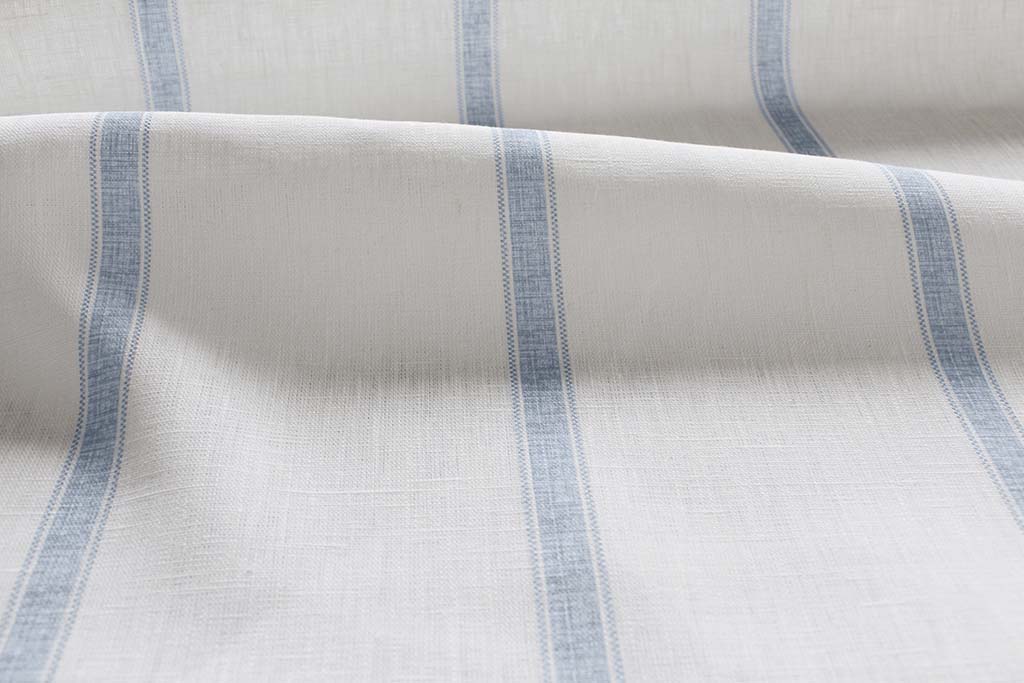 Rune Agate Blue - vertical blue tone striped fabric.