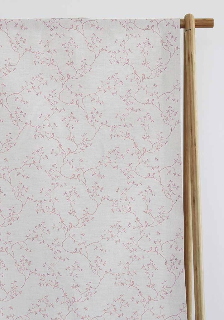 Pale pink Botanical Floral Fabric with birds sitting on tree branches