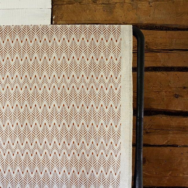 Sylvia Terracotta - Orange abstract print on Natural fabric